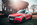 Audi A1 in Teckwrap crimson red vor Waggon mit untergehende Sonne